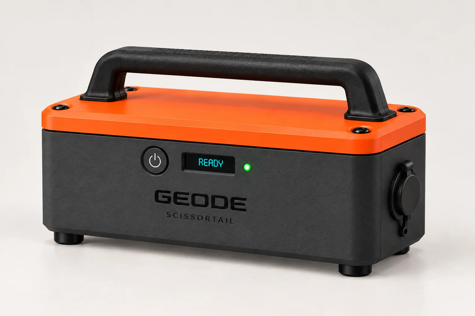 Portable Geode on small feet, with a charcoal body, orange lid, fixed carry handle, OLED, and one green status light